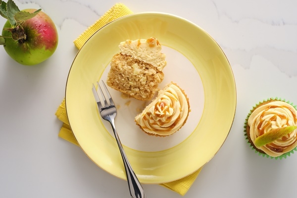 sticky caramel apple cupcake on a yellow plate