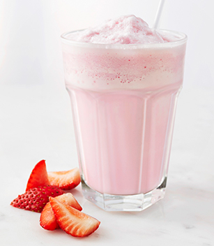 A glass of strawberry milkshake